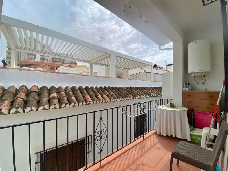 Spacious  town house with an interior patio and several rooms distributed between the two main floors.