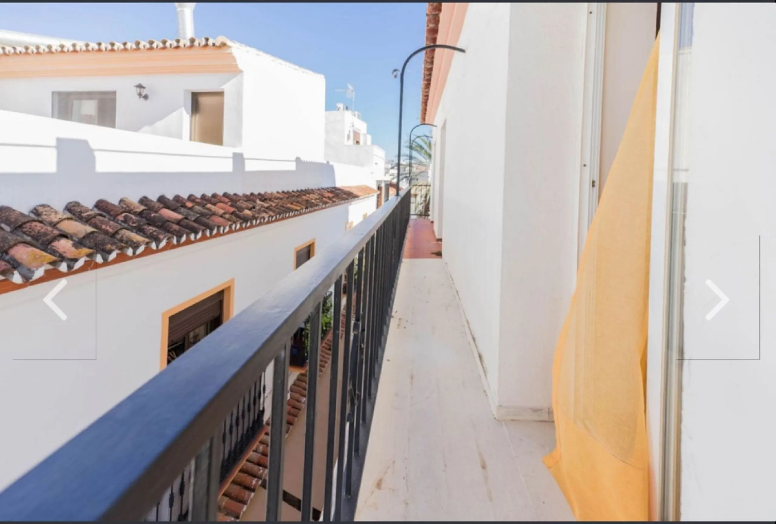Spacious  town house with an interior patio and several rooms distributed between the two main floors.