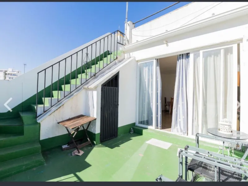 Spacious  town house with an interior patio and several rooms distributed between the two main floors.