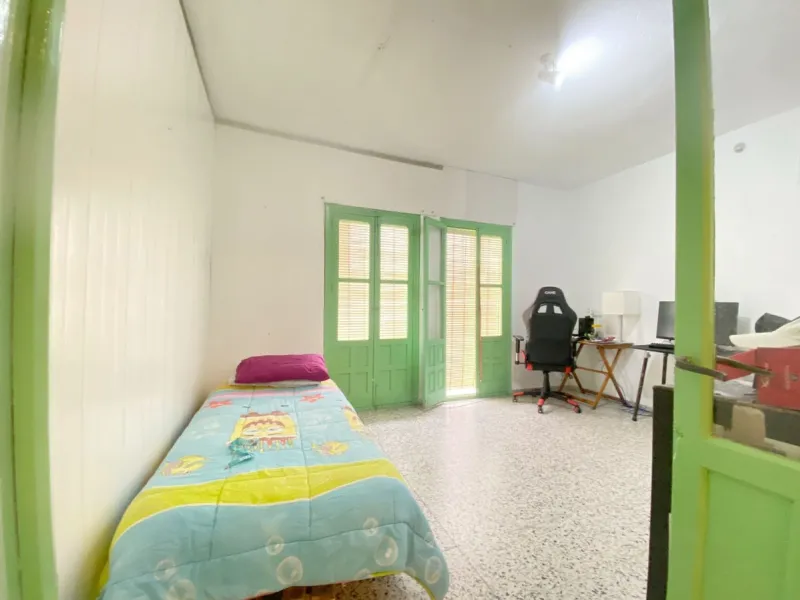 Spacious  town house with an interior patio and several rooms distributed between the two main floors.