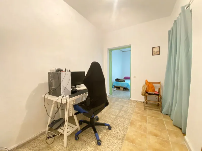 Spacious  town house with an interior patio and several rooms distributed between the two main floors.