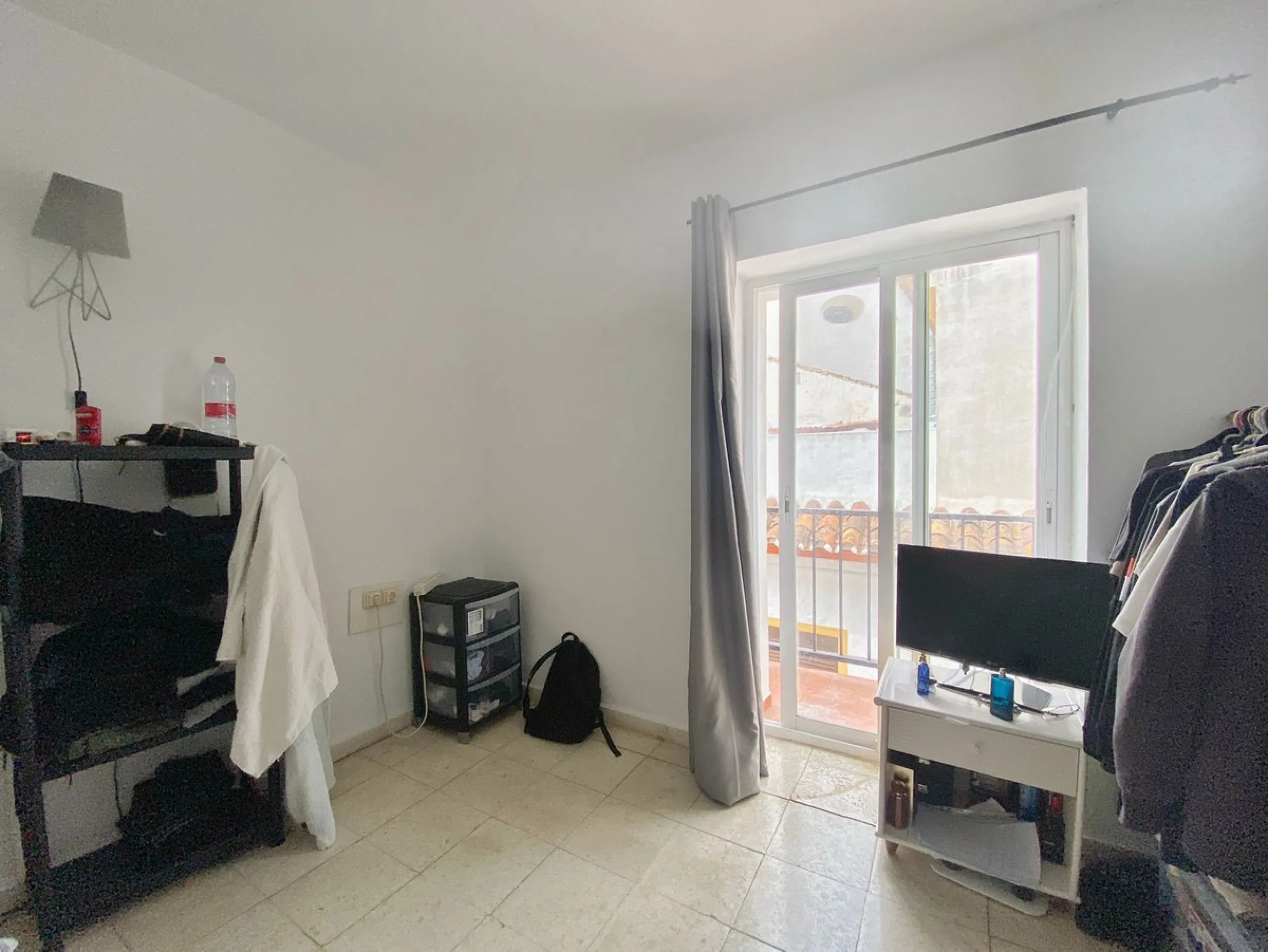 Spacious  town house with an interior patio and several rooms distributed between the two main floors.