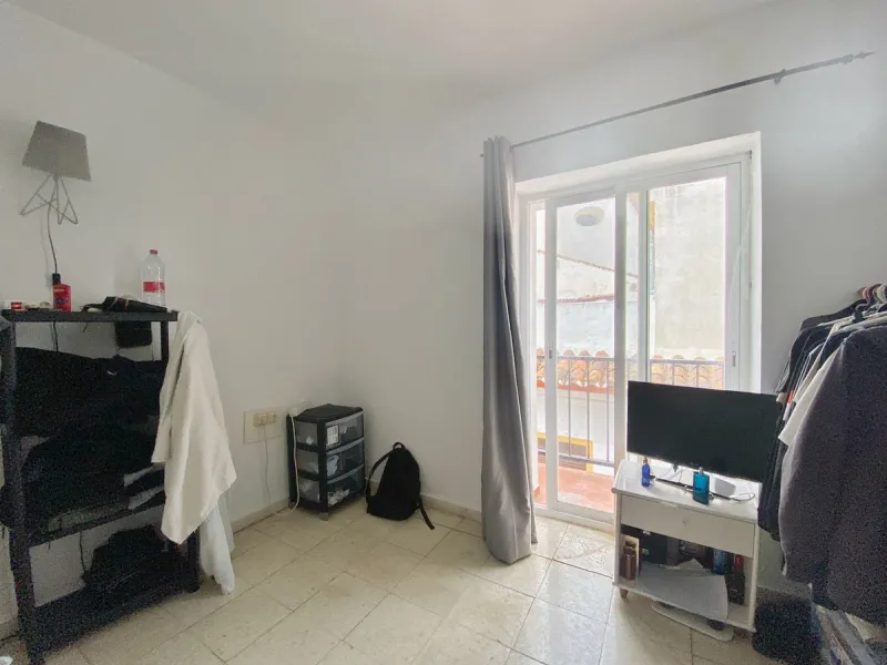 Spacious  town house with an interior patio and several rooms distributed between the two main floors.