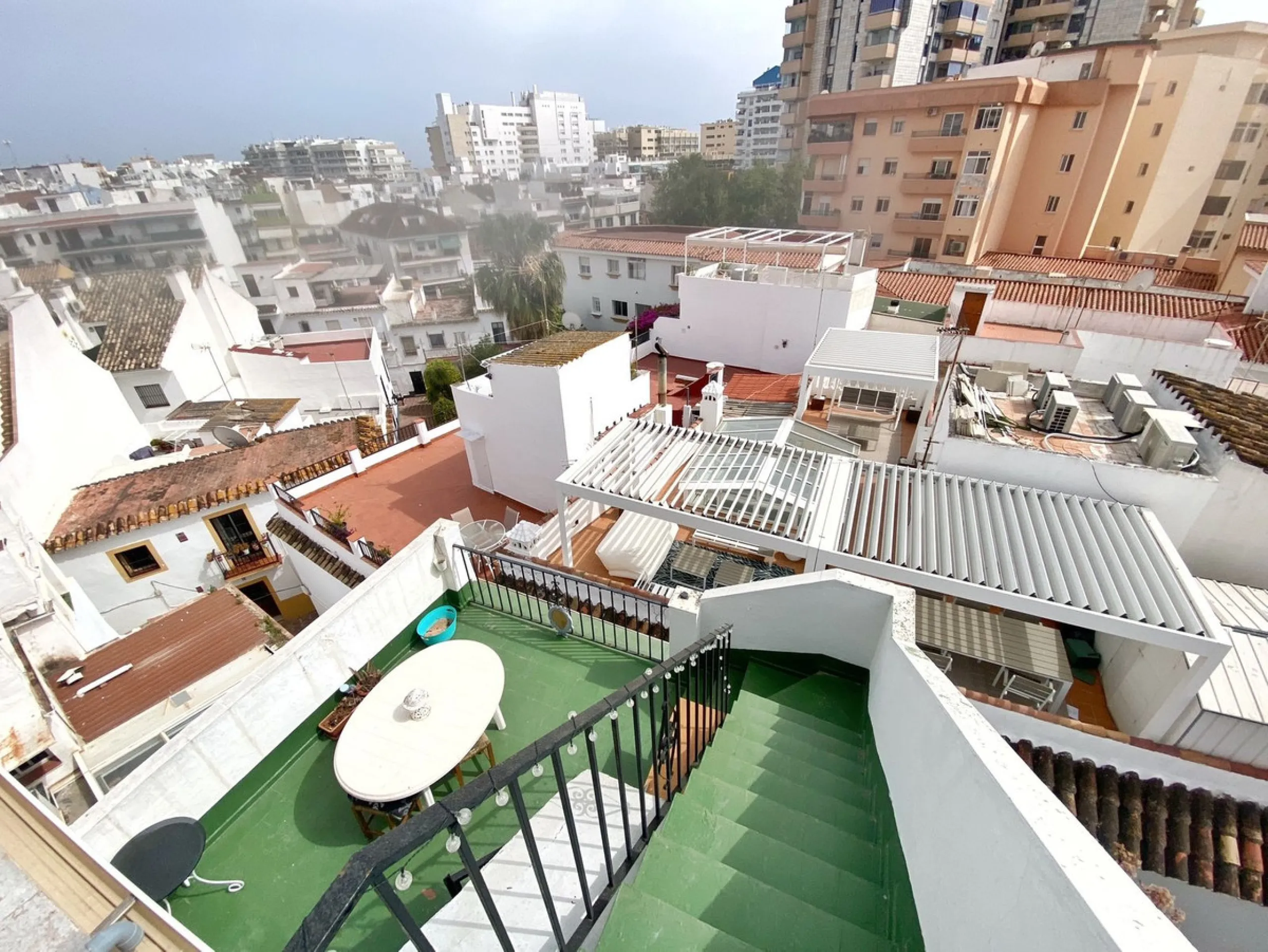 Spacious  town house with an interior patio and several rooms distributed between the two main floors.