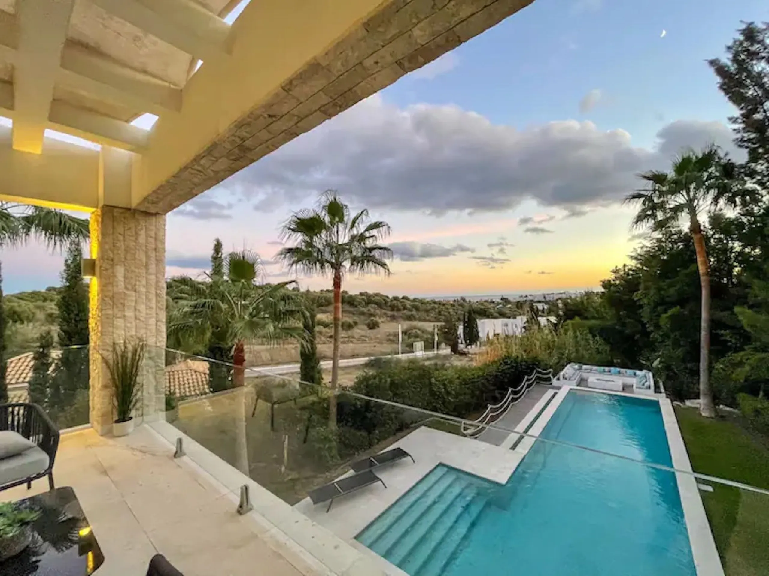 This magnificent villa is an open plan one, and the ground floor flows into the terrace and the garden with lovely sea views and a vast infinity pool, leading to a chill-out area with a fireplace. The villa has ensuite bedrooms on each floor, which gives 