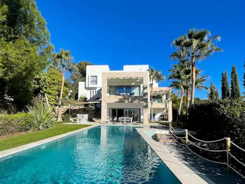 This magnificent villa is an open plan one, and the ground floor flows into the terrace and the garden with lovely sea views and a vast infinity pool, leading to a chill-out area with a fireplace. The villa has ensuite bedrooms on each floor, which gives 