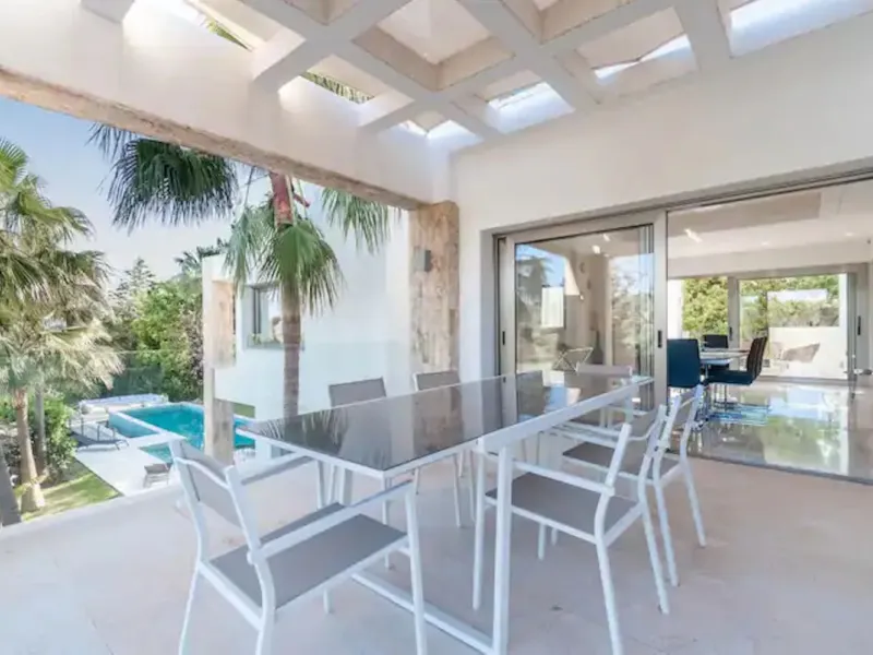 This magnificent villa is an open plan one, and the ground floor flows into the terrace and the garden with lovely sea views and a vast infinity pool, leading to a chill-out area with a fireplace. The villa has ensuite bedrooms on each floor, which gives 