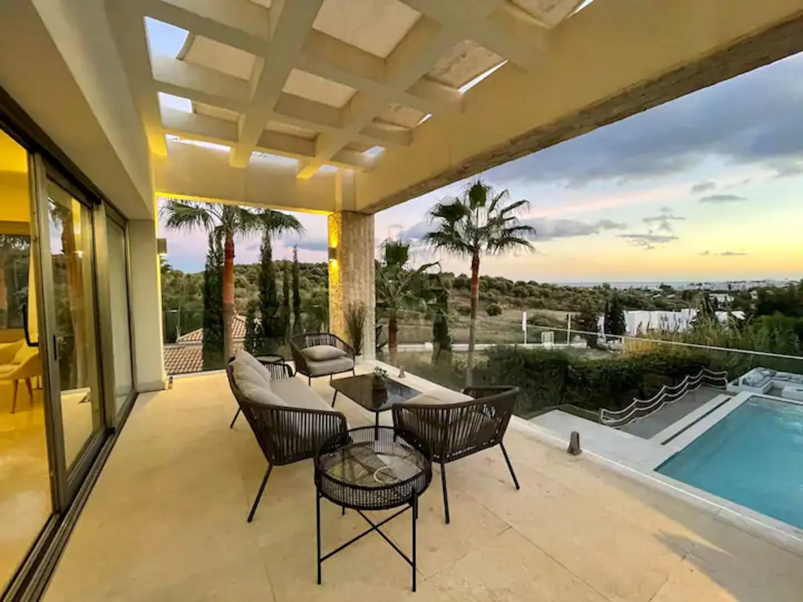 This magnificent villa is an open plan one, and the ground floor flows into the terrace and the garden with lovely sea views and a vast infinity pool, leading to a chill-out area with a fireplace. The villa has ensuite bedrooms on each floor, which gives 