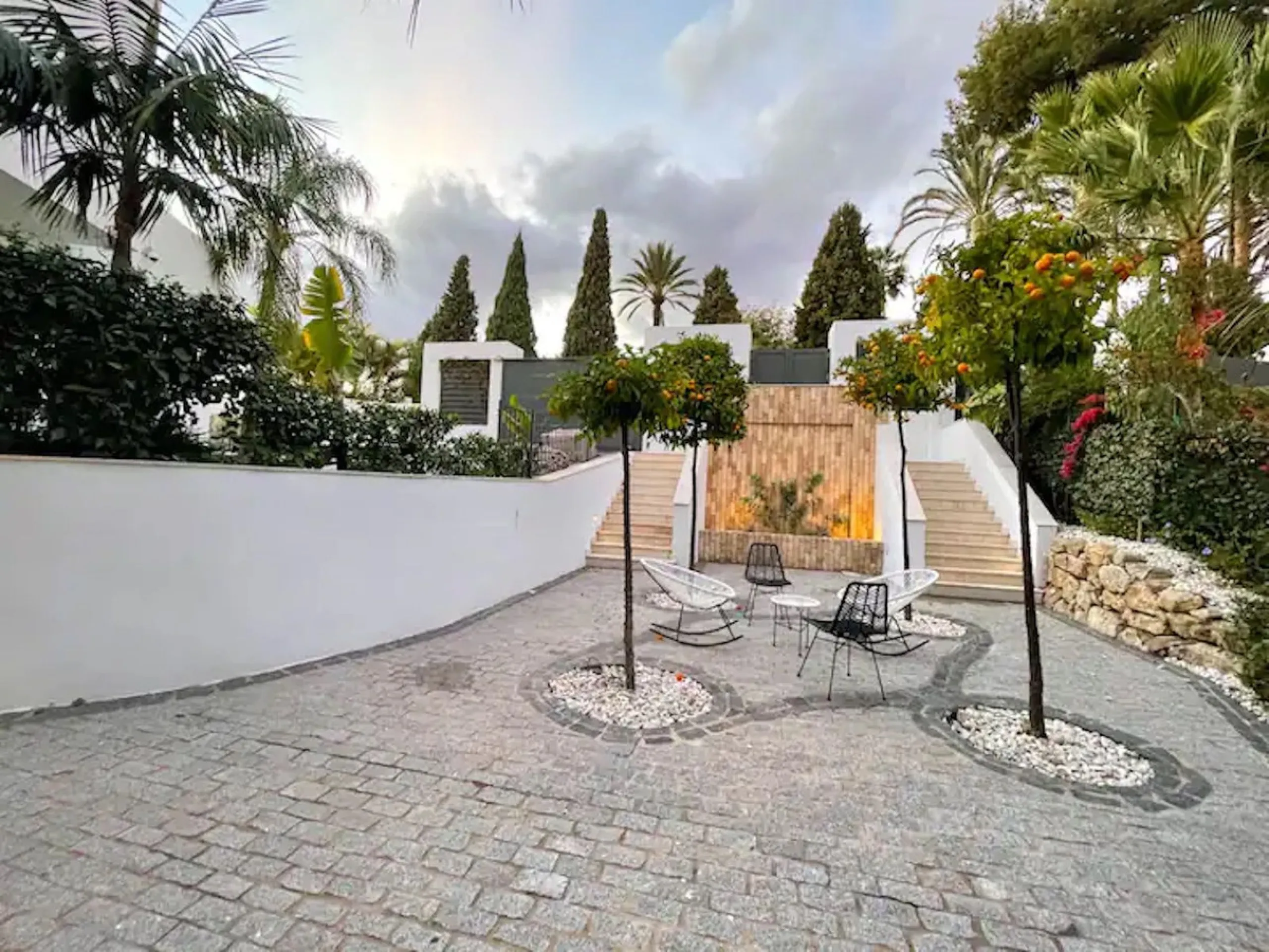 This magnificent villa is an open plan one, and the ground floor flows into the terrace and the garden with lovely sea views and a vast infinity pool, leading to a chill-out area with a fireplace. The villa has ensuite bedrooms on each floor, which gives 