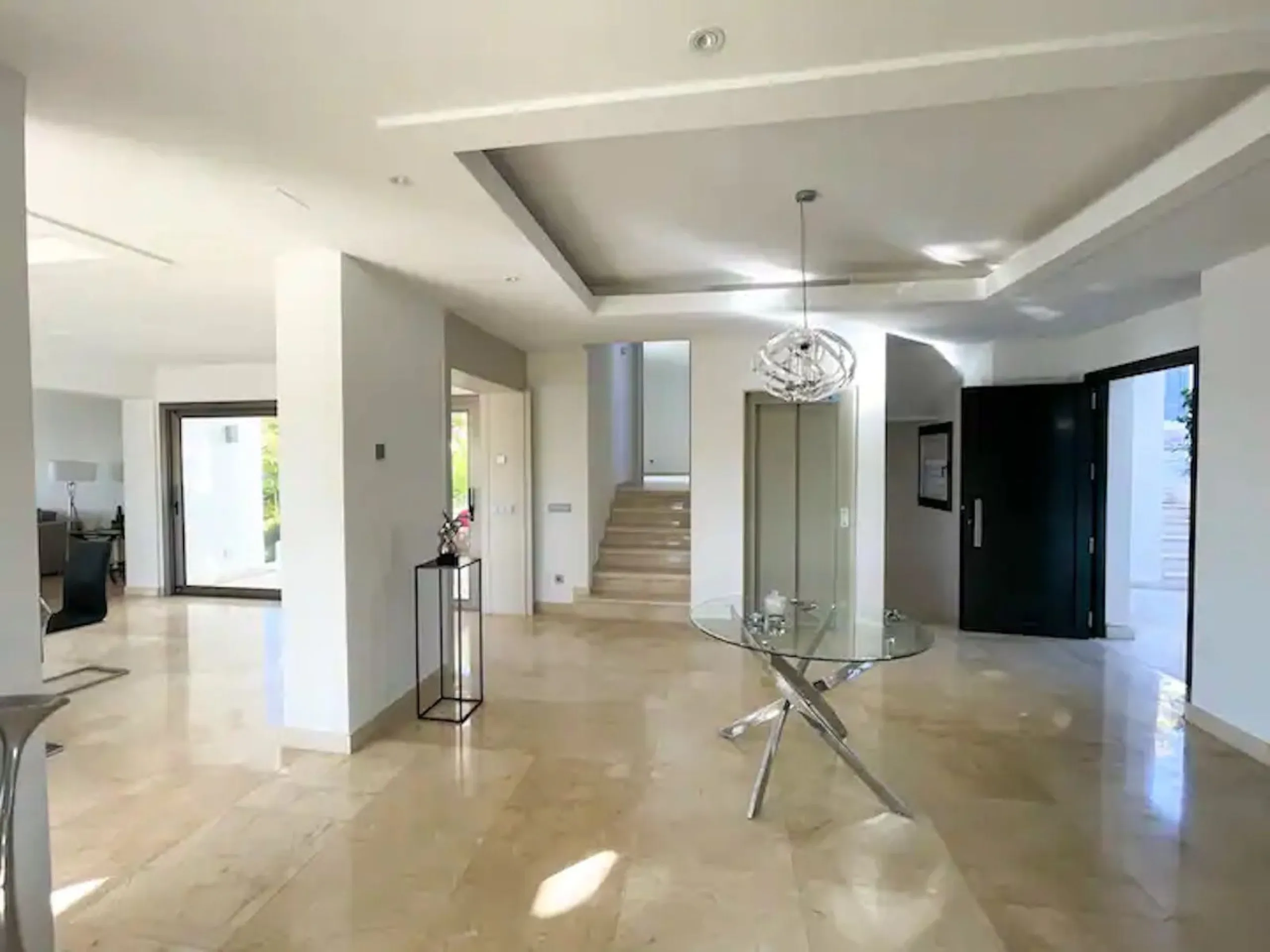 This magnificent villa is an open plan one, and the ground floor flows into the terrace and the garden with lovely sea views and a vast infinity pool, leading to a chill-out area with a fireplace. The villa has ensuite bedrooms on each floor, which gives 