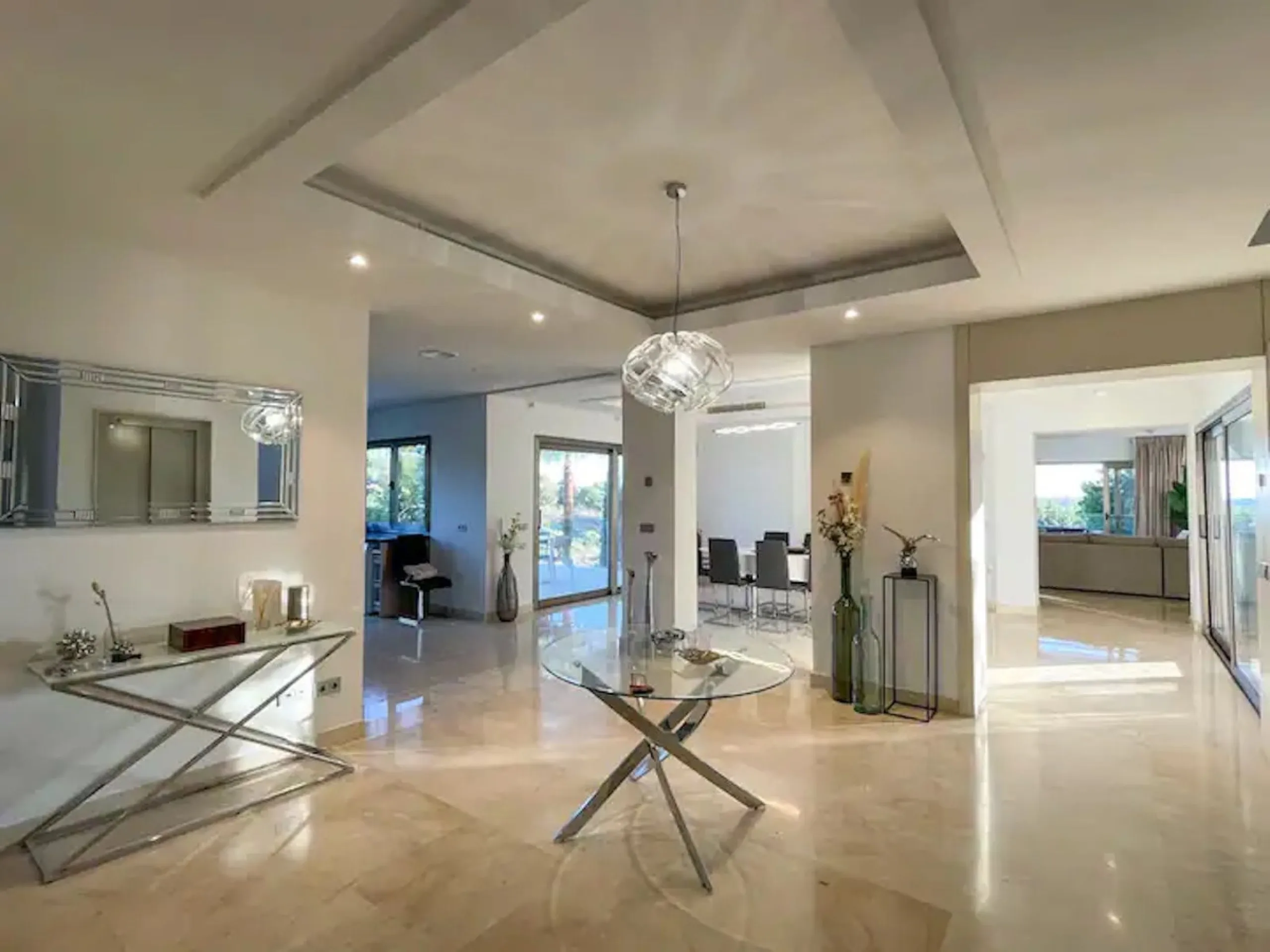 This magnificent villa is an open plan one, and the ground floor flows into the terrace and the garden with lovely sea views and a vast infinity pool, leading to a chill-out area with a fireplace. The villa has ensuite bedrooms on each floor, which gives 