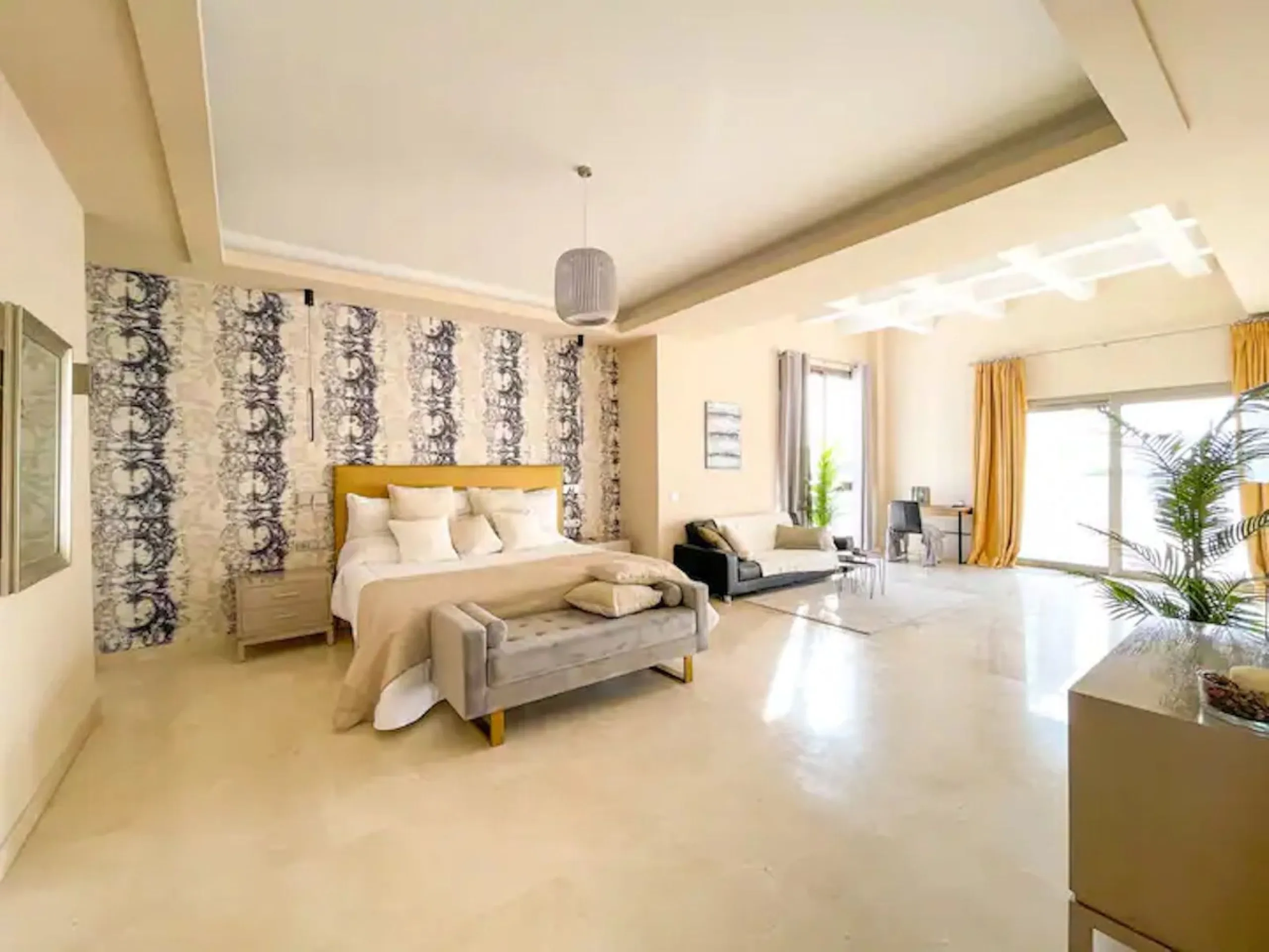 This magnificent villa is an open plan one, and the ground floor flows into the terrace and the garden with lovely sea views and a vast infinity pool, leading to a chill-out area with a fireplace. The villa has ensuite bedrooms on each floor, which gives 