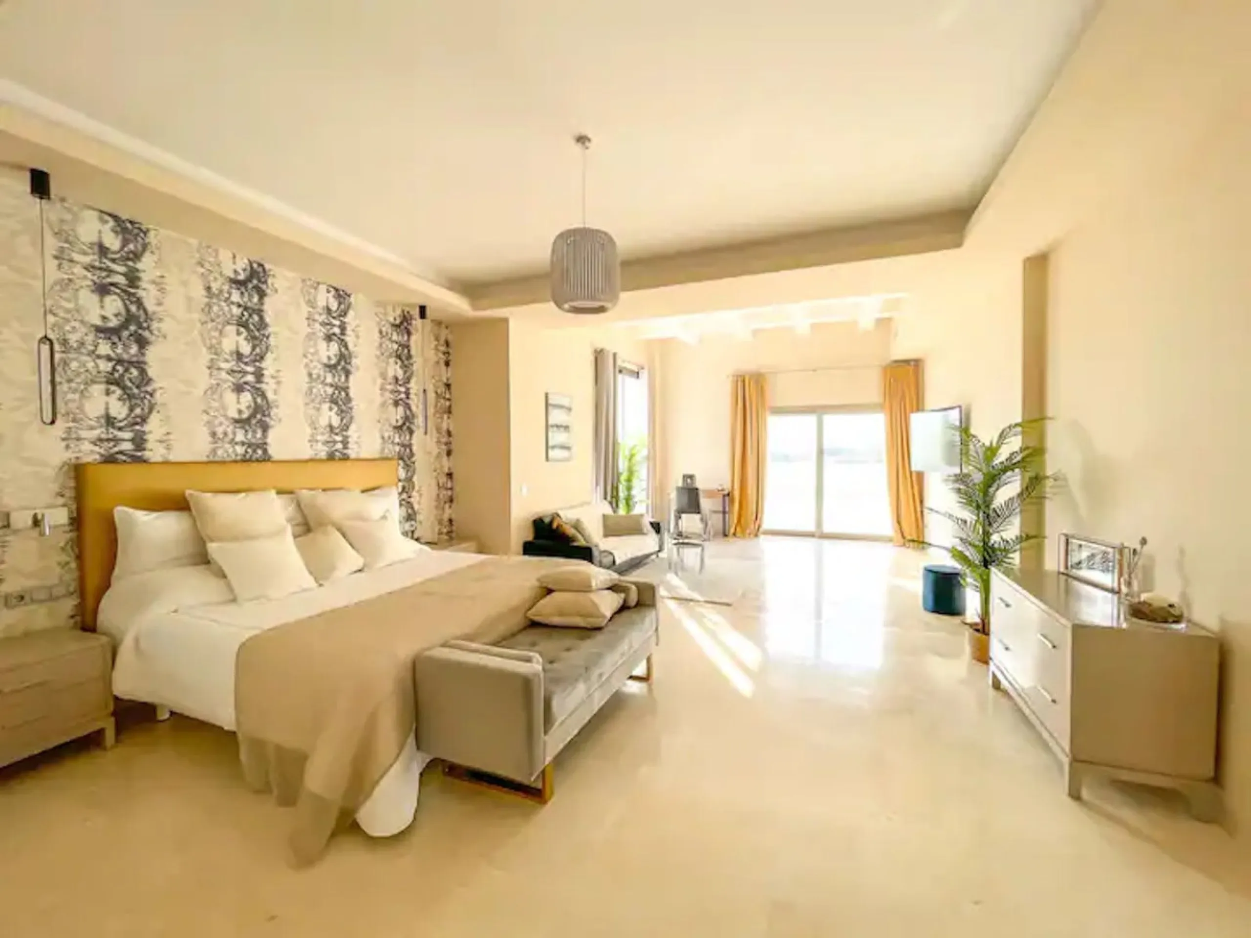 This magnificent villa is an open plan one, and the ground floor flows into the terrace and the garden with lovely sea views and a vast infinity pool, leading to a chill-out area with a fireplace. The villa has ensuite bedrooms on each floor, which gives 