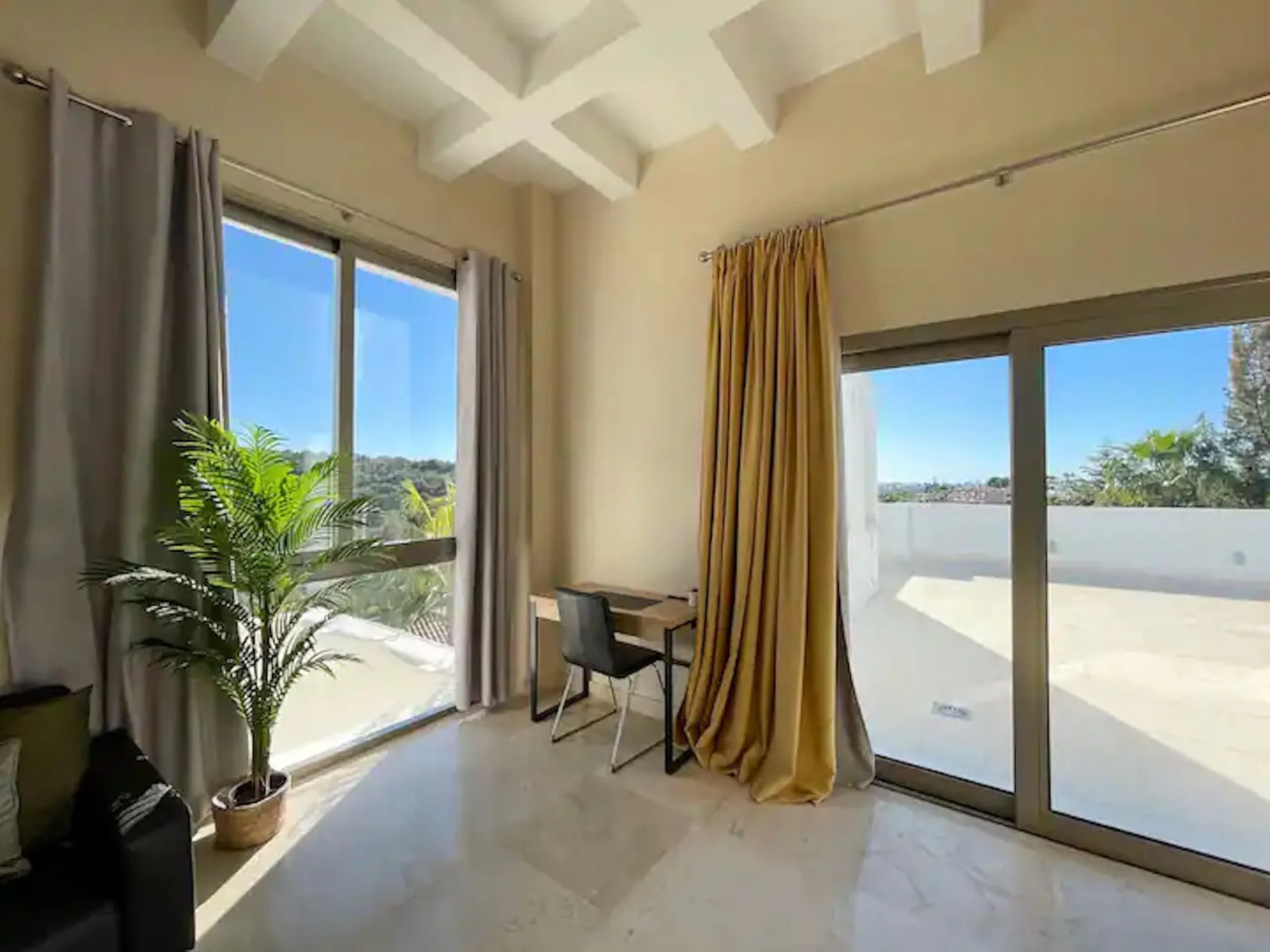 This magnificent villa is an open plan one, and the ground floor flows into the terrace and the garden with lovely sea views and a vast infinity pool, leading to a chill-out area with a fireplace. The villa has ensuite bedrooms on each floor, which gives 