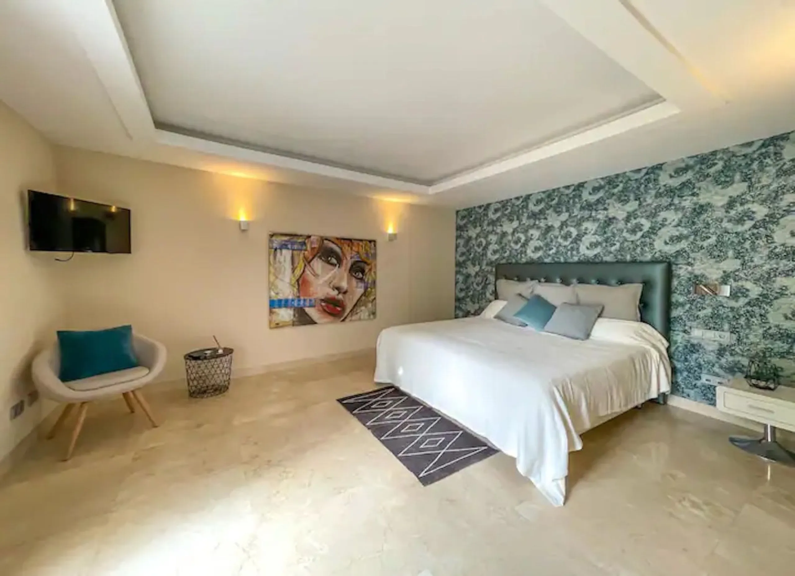 This magnificent villa is an open plan one, and the ground floor flows into the terrace and the garden with lovely sea views and a vast infinity pool, leading to a chill-out area with a fireplace. The villa has ensuite bedrooms on each floor, which gives 