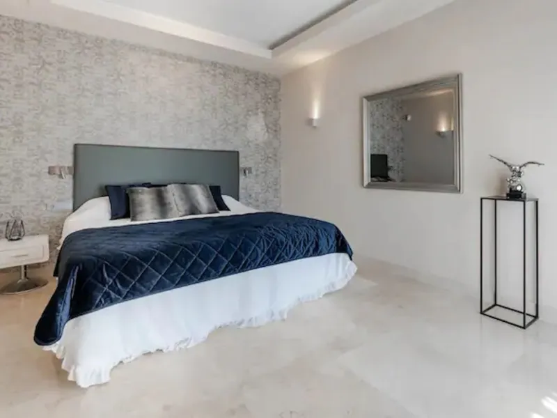 This magnificent villa is an open plan one, and the ground floor flows into the terrace and the garden with lovely sea views and a vast infinity pool, leading to a chill-out area with a fireplace. The villa has ensuite bedrooms on each floor, which gives 