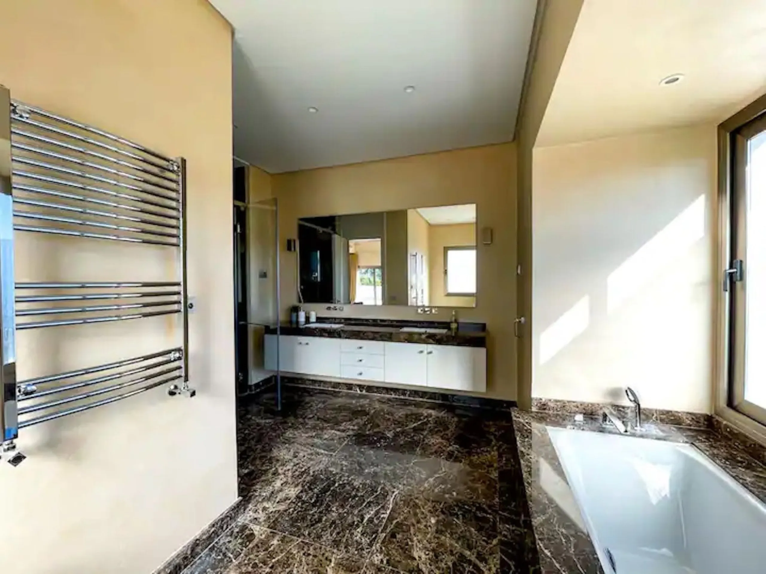 This magnificent villa is an open plan one, and the ground floor flows into the terrace and the garden with lovely sea views and a vast infinity pool, leading to a chill-out area with a fireplace. The villa has ensuite bedrooms on each floor, which gives 