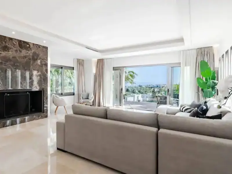 This magnificent villa is an open plan one, and the ground floor flows into the terrace and the garden with lovely sea views and a vast infinity pool, leading to a chill-out area with a fireplace. The villa has ensuite bedrooms on each floor, which gives 