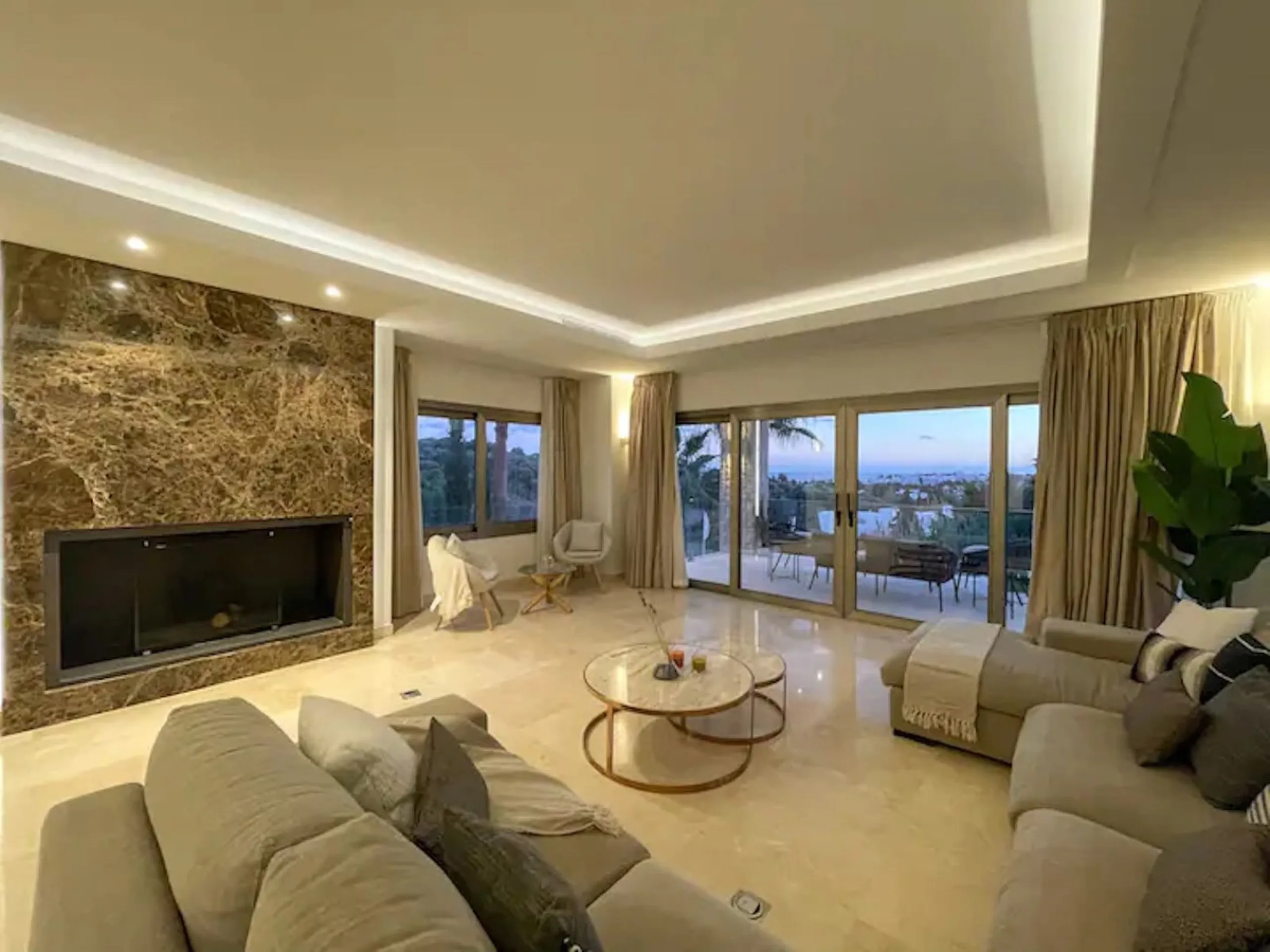 This magnificent villa is an open plan one, and the ground floor flows into the terrace and the garden with lovely sea views and a vast infinity pool, leading to a chill-out area with a fireplace. The villa has ensuite bedrooms on each floor, which gives 