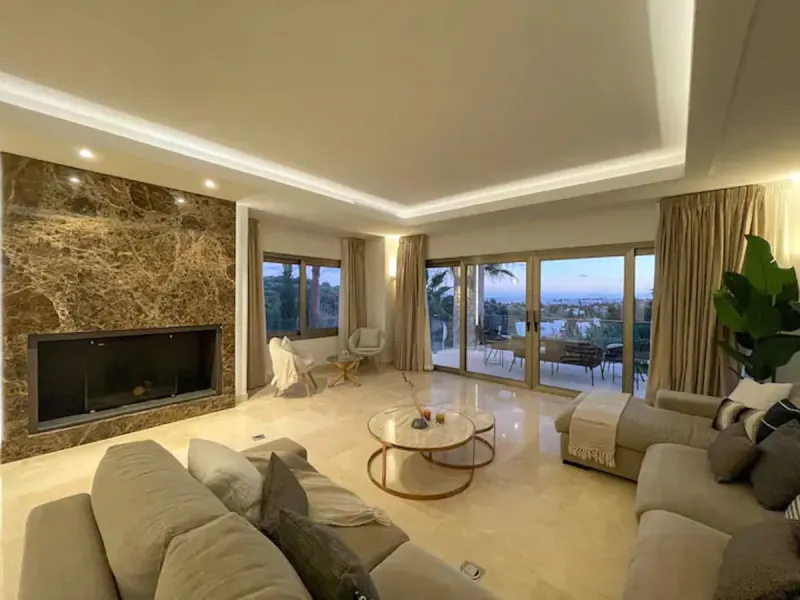 This magnificent villa is an open plan one, and the ground floor flows into the terrace and the garden with lovely sea views and a vast infinity pool, leading to a chill-out area with a fireplace. The villa has ensuite bedrooms on each floor, which gives 