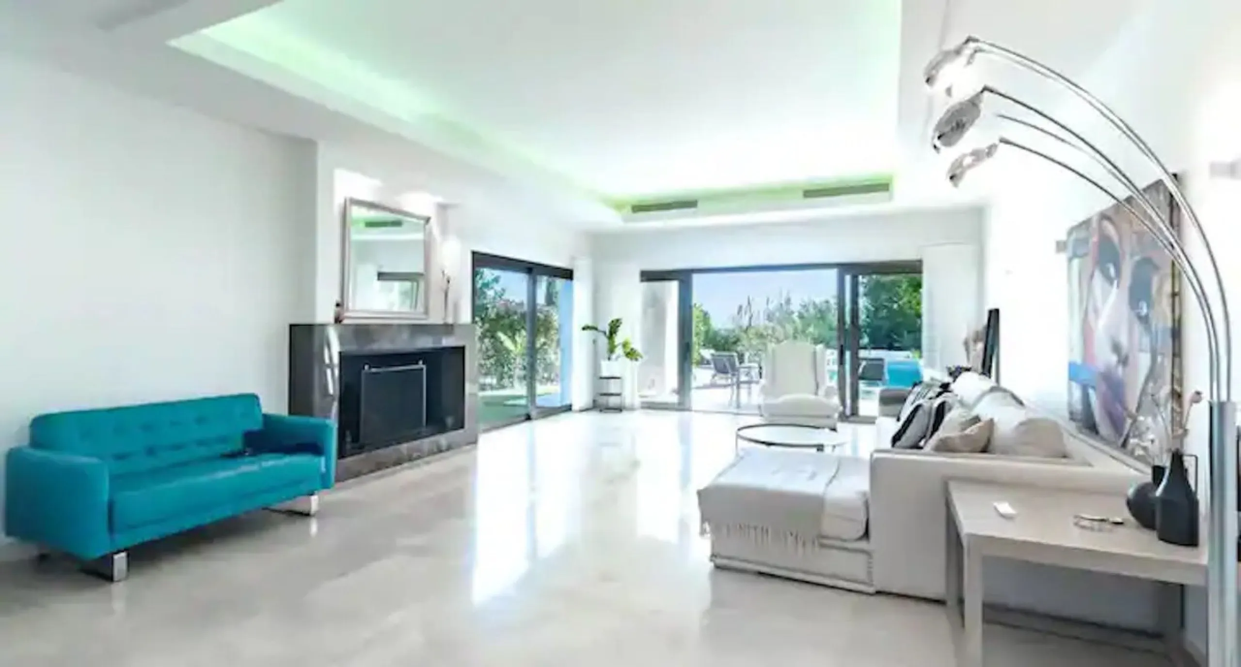 This magnificent villa is an open plan one, and the ground floor flows into the terrace and the garden with lovely sea views and a vast infinity pool, leading to a chill-out area with a fireplace. The villa has ensuite bedrooms on each floor, which gives 