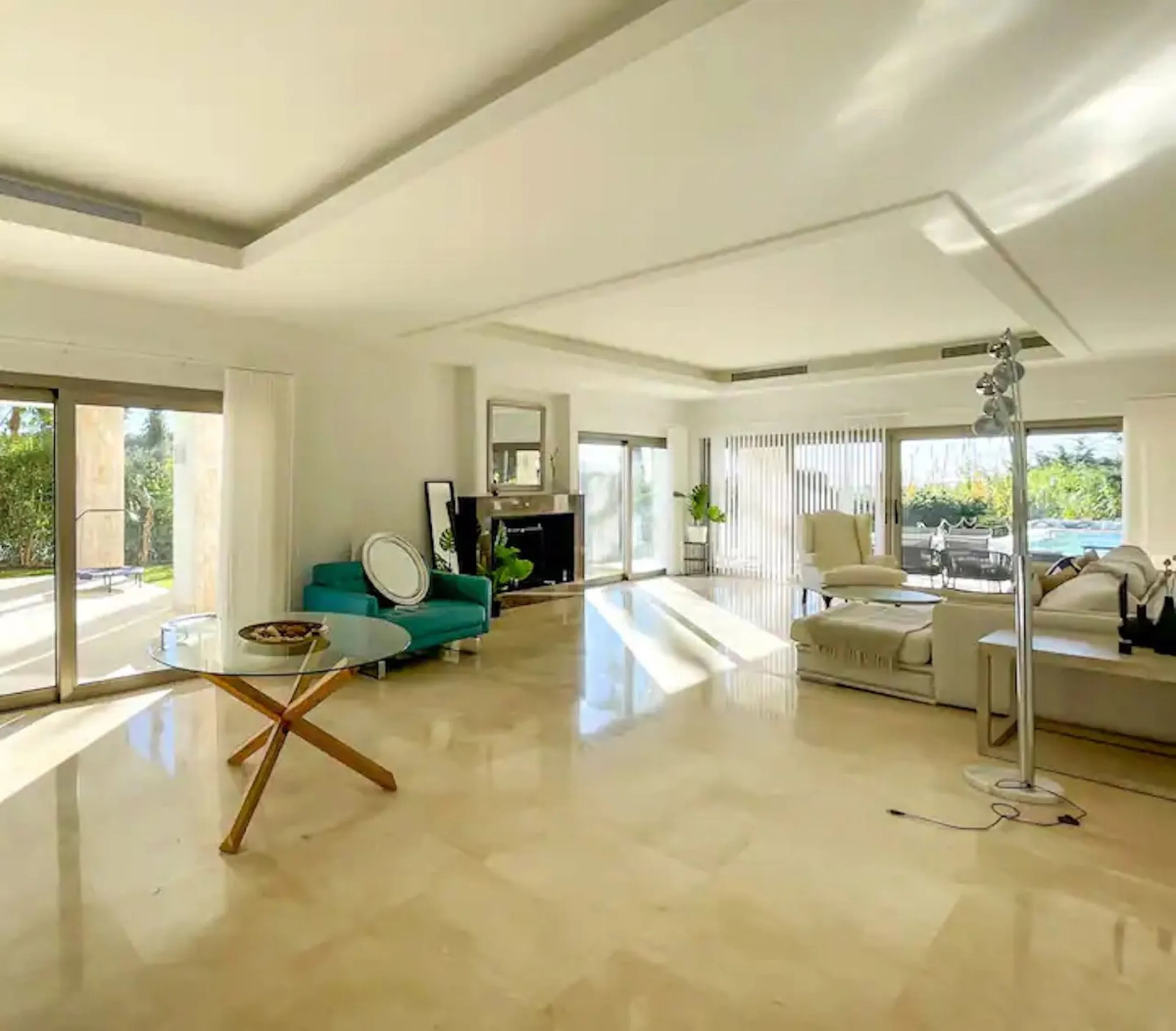 This magnificent villa is an open plan one, and the ground floor flows into the terrace and the garden with lovely sea views and a vast infinity pool, leading to a chill-out area with a fireplace. The villa has ensuite bedrooms on each floor, which gives 