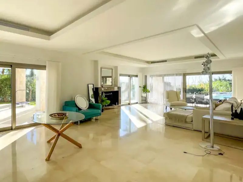 This magnificent villa is an open plan one, and the ground floor flows into the terrace and the garden with lovely sea views and a vast infinity pool, leading to a chill-out area with a fireplace. The villa has ensuite bedrooms on each floor, which gives 