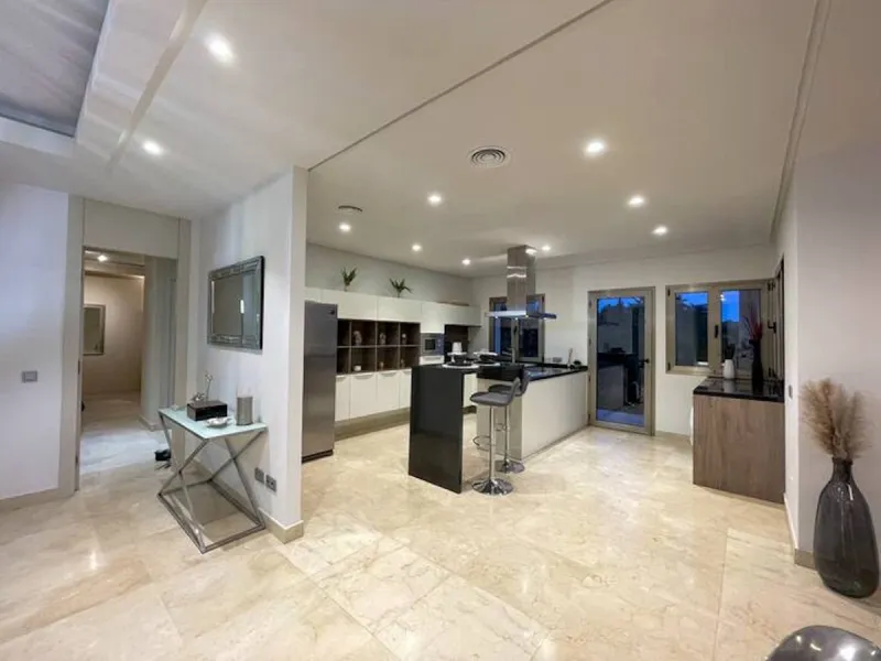 This magnificent villa is an open plan one, and the ground floor flows into the terrace and the garden with lovely sea views and a vast infinity pool, leading to a chill-out area with a fireplace. The villa has ensuite bedrooms on each floor, which gives 
