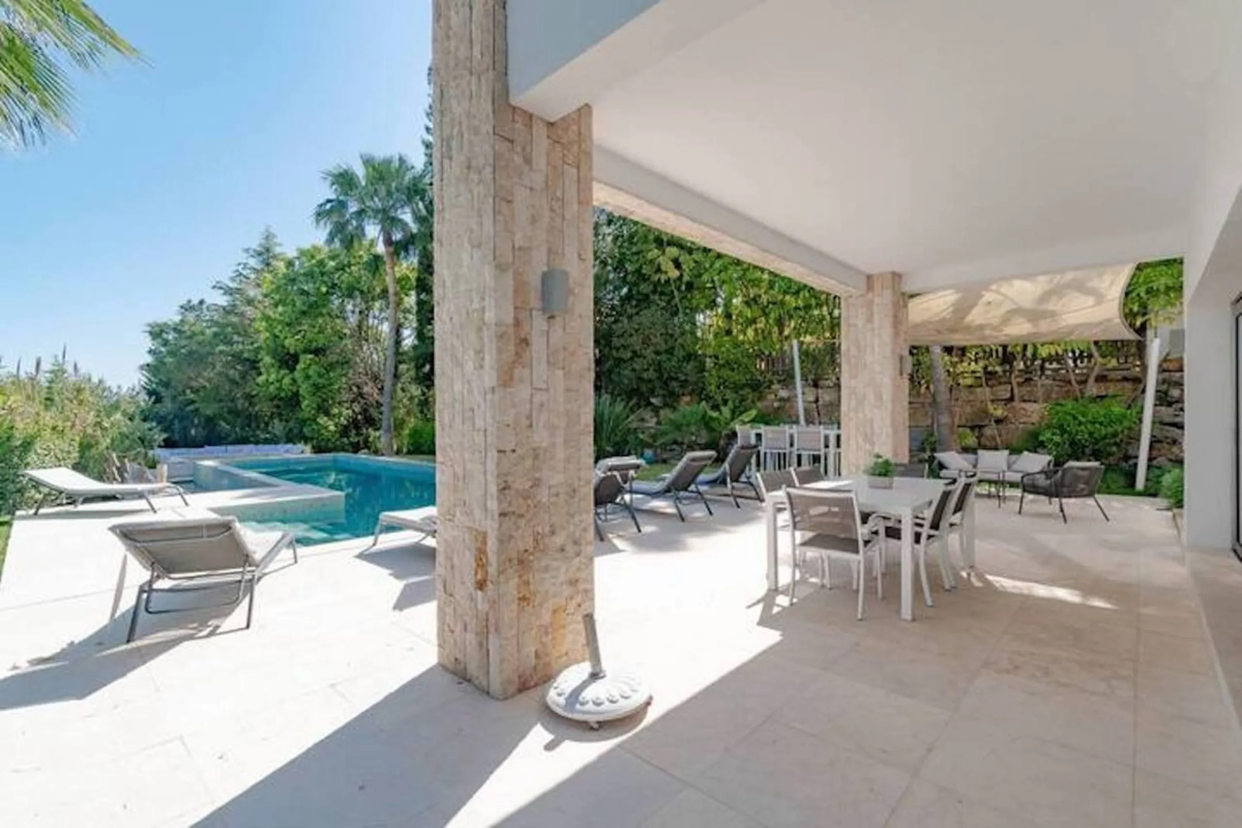 This magnificent villa is an open plan one, and the ground floor flows into the terrace and the garden with lovely sea views and a vast infinity pool, leading to a chill-out area with a fireplace. The villa has ensuite bedrooms on each floor, which gives 