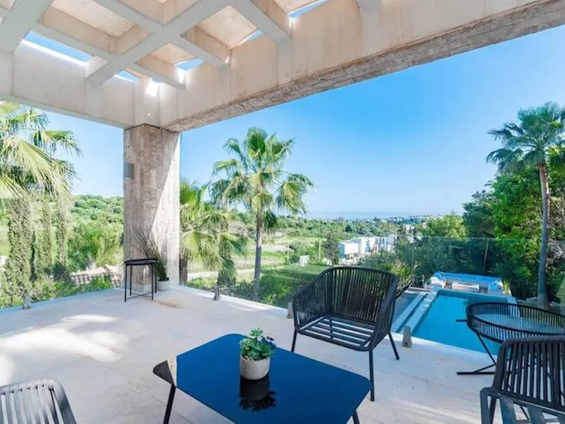 This magnificent villa is an open plan one, and the ground floor flows into the terrace and the garden with lovely sea views and a vast infinity pool, leading to a chill-out area with a fireplace. The villa has ensuite bedrooms on each floor, which gives 
