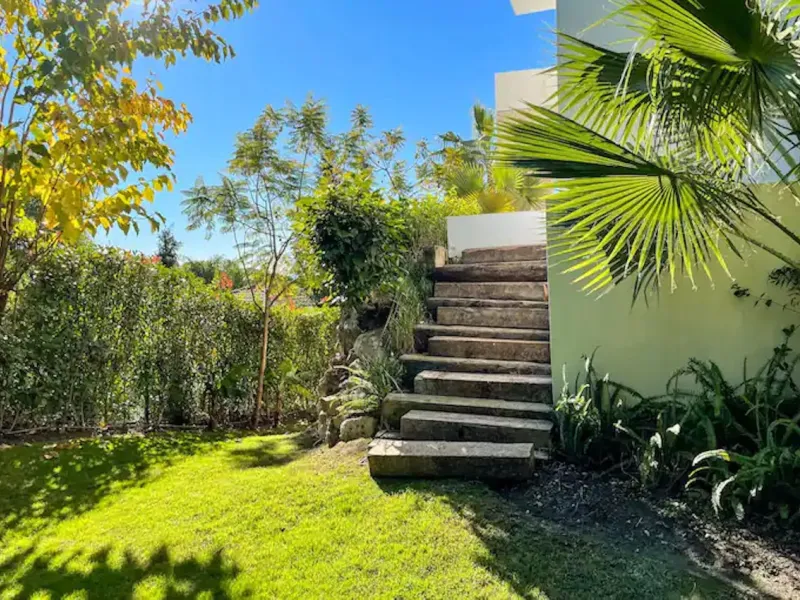 This magnificent villa is an open plan one, and the ground floor flows into the terrace and the garden with lovely sea views and a vast infinity pool, leading to a chill-out area with a fireplace. The villa has ensuite bedrooms on each floor, which gives 