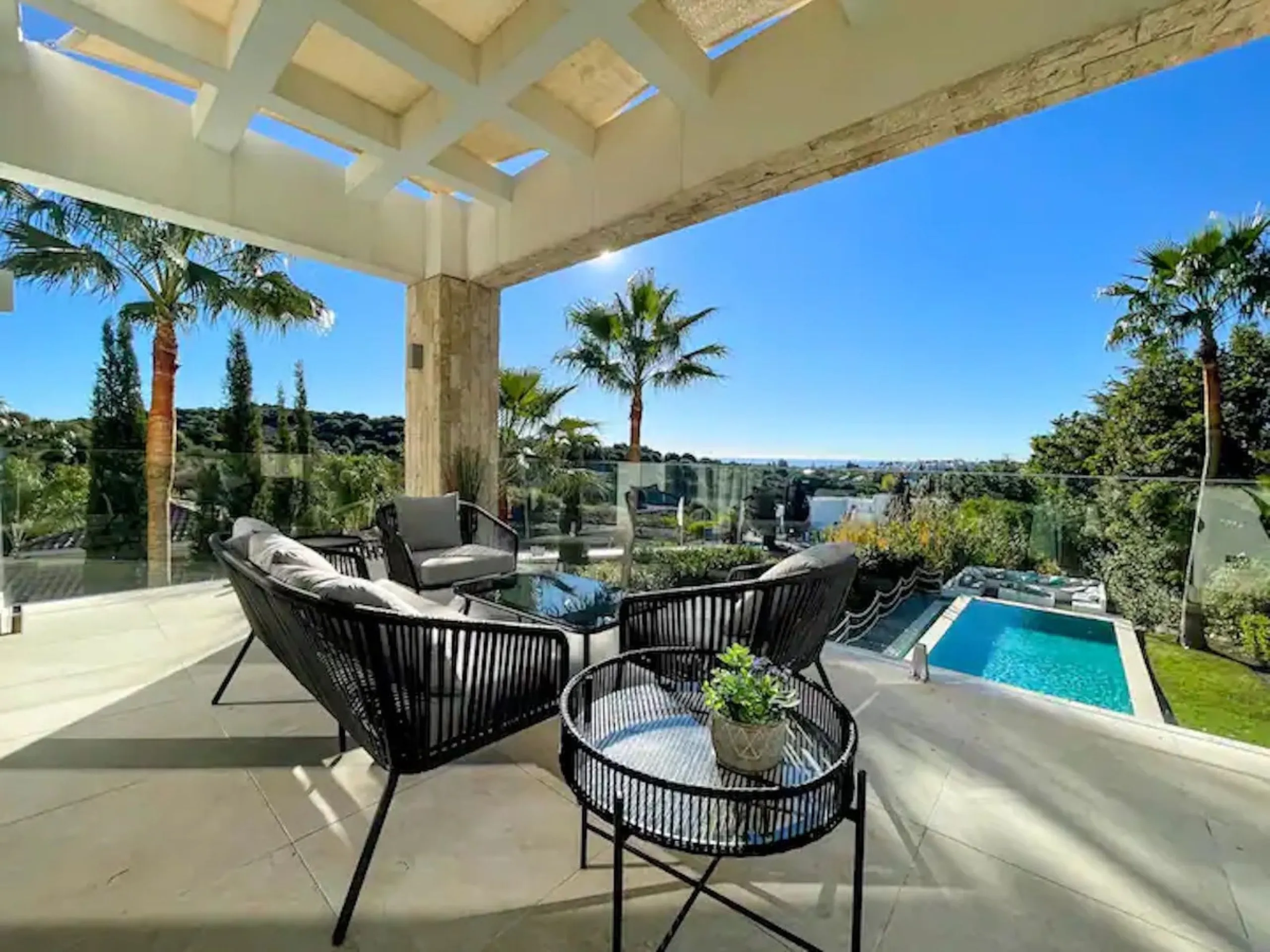 This magnificent villa is an open plan one, and the ground floor flows into the terrace and the garden with lovely sea views and a vast infinity pool, leading to a chill-out area with a fireplace. The villa has ensuite bedrooms on each floor, which gives 