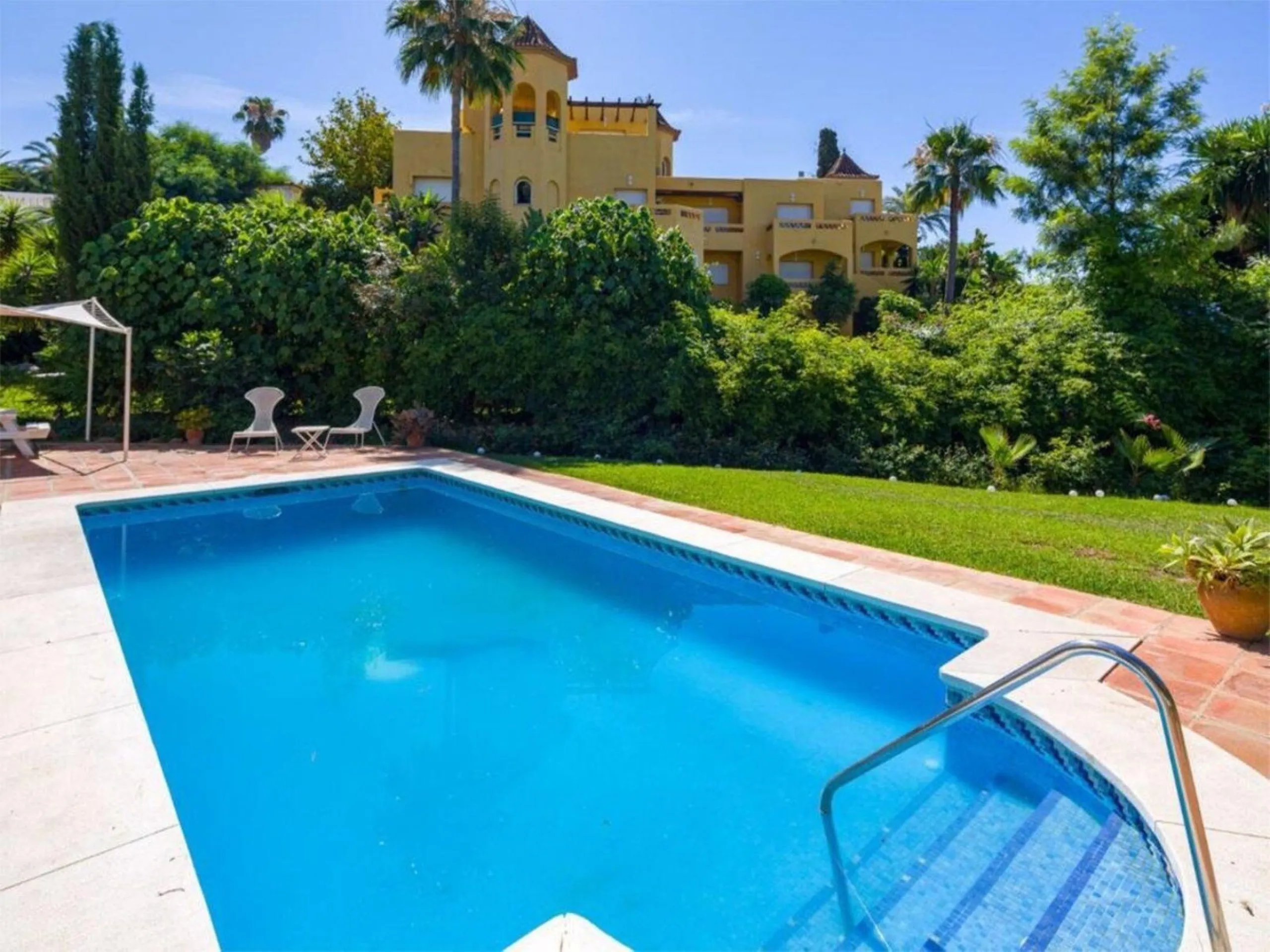 Nestled in the heart of Marbella's prestigious residential area, this elegant villa is a rare find, combining timeless Mediterranean charm with the potential for modern customization. With four bedrooms thoughtfully spread across two floors, this property