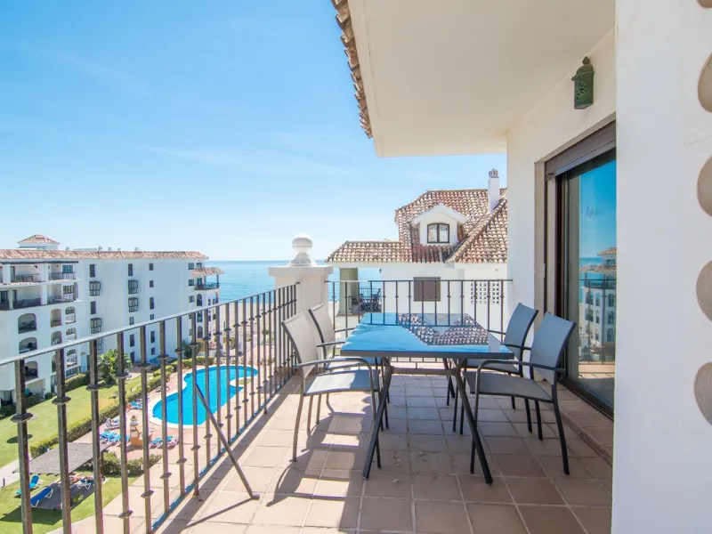 This exceptional two-bedroom, two-bathroom apartment is perfectly positioned on the front line of the beach in the sought-after area of Puerto La Duquesa, Manilva, Malaga. Offering a harmonious blend of comfort, style, and convenience, the property stands