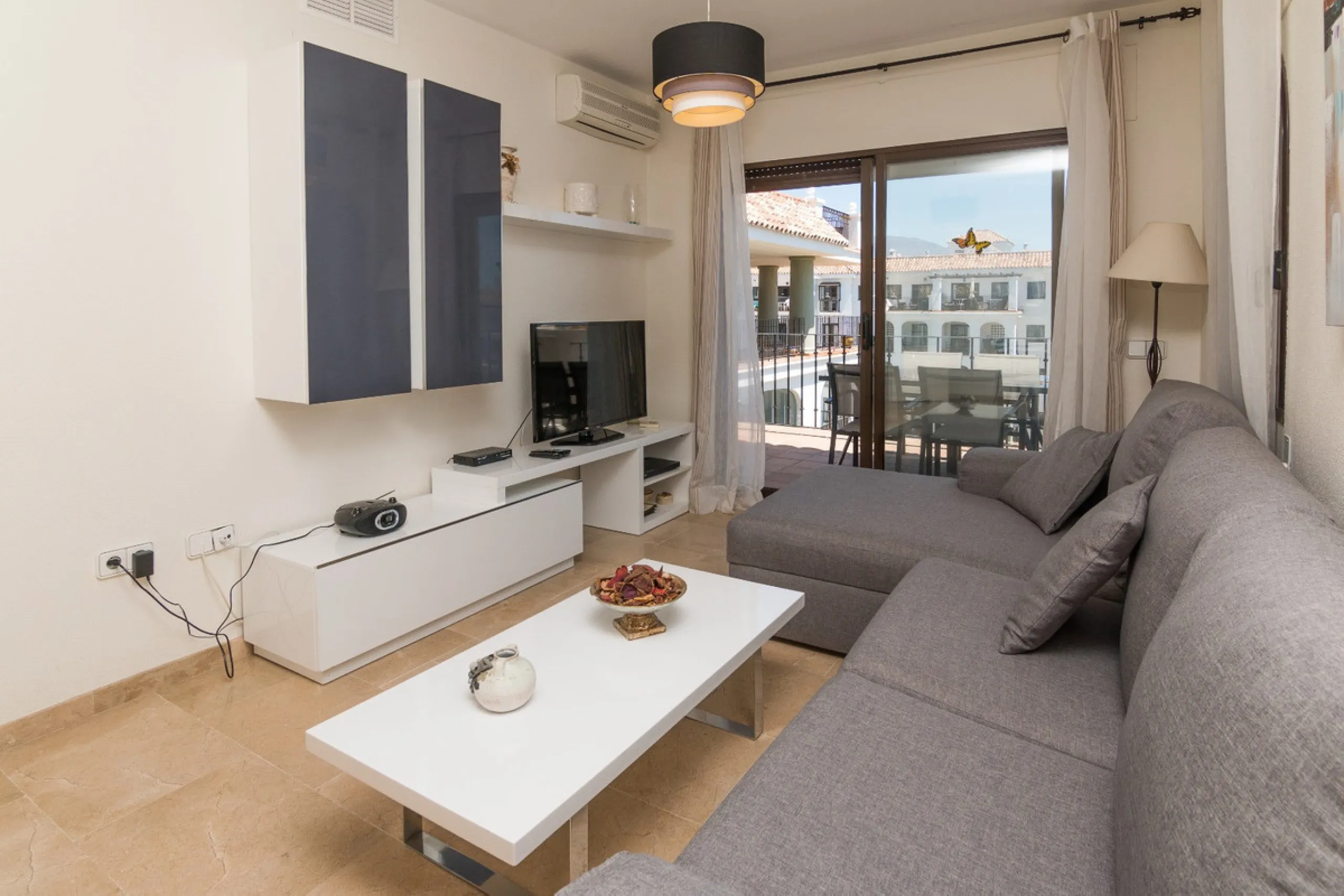 This exceptional two-bedroom, two-bathroom apartment is perfectly positioned on the front line of the beach in the sought-after area of Puerto La Duquesa, Manilva, Malaga. Offering a harmonious blend of comfort, style, and convenience, the property stands