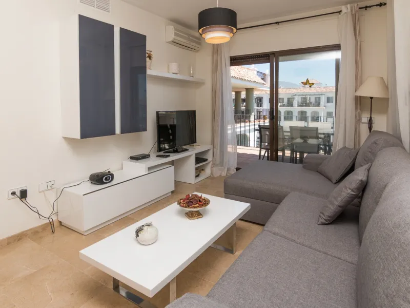 This exceptional two-bedroom, two-bathroom apartment is perfectly positioned on the front line of the beach in the sought-after area of Puerto La Duquesa, Manilva, Malaga. Offering a harmonious blend of comfort, style, and convenience, the property stands