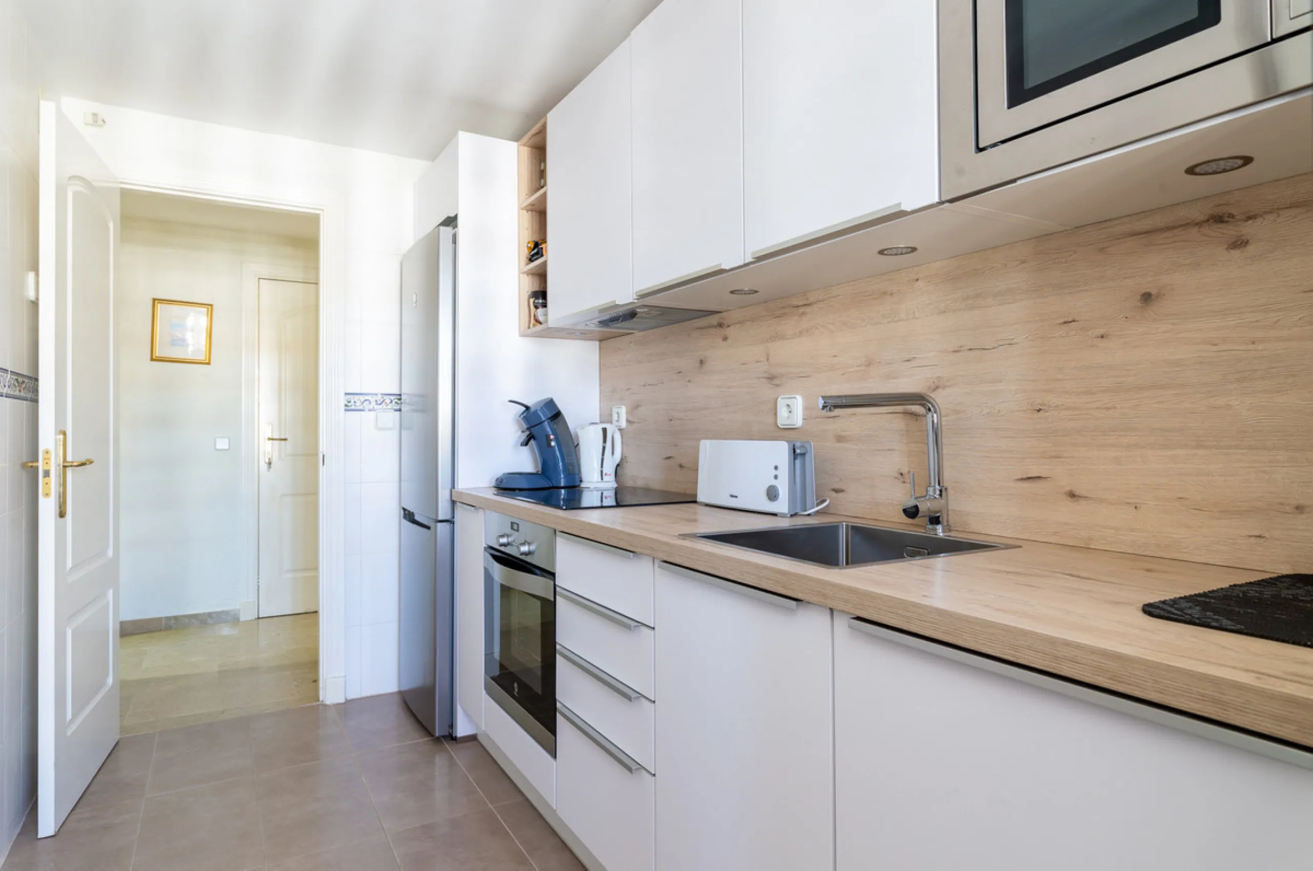 This exceptional two-bedroom, two-bathroom apartment is perfectly positioned on the front line of the beach in the sought-after area of Puerto La Duquesa, Manilva, Malaga. Offering a harmonious blend of comfort, style, and convenience, the property stands