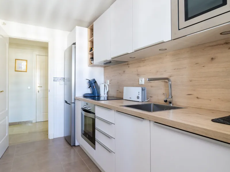 This exceptional two-bedroom, two-bathroom apartment is perfectly positioned on the front line of the beach in the sought-after area of Puerto La Duquesa, Manilva, Malaga. Offering a harmonious blend of comfort, style, and convenience, the property stands