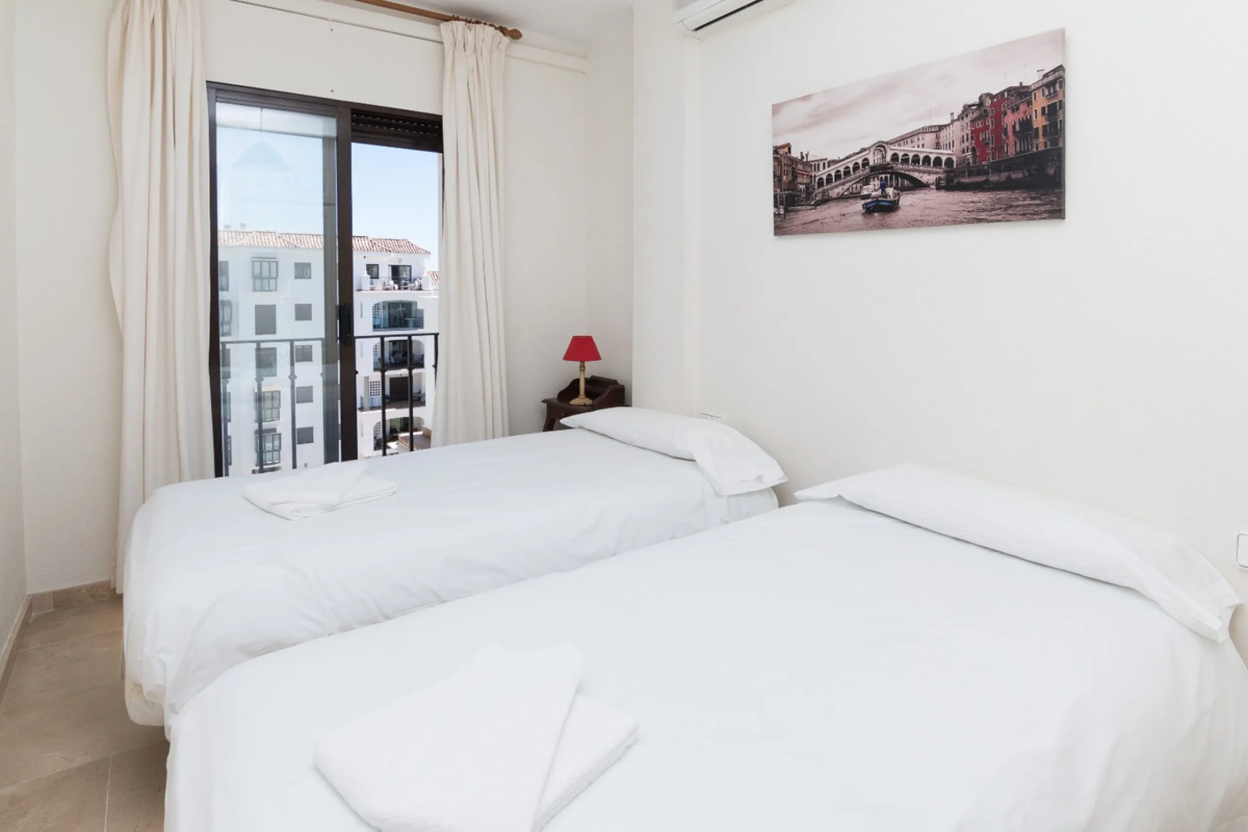 This exceptional two-bedroom, two-bathroom apartment is perfectly positioned on the front line of the beach in the sought-after area of Puerto La Duquesa, Manilva, Malaga. Offering a harmonious blend of comfort, style, and convenience, the property stands