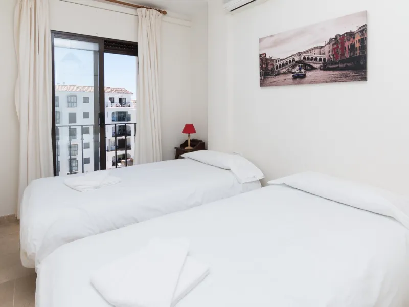 This exceptional two-bedroom, two-bathroom apartment is perfectly positioned on the front line of the beach in the sought-after area of Puerto La Duquesa, Manilva, Malaga. Offering a harmonious blend of comfort, style, and convenience, the property stands