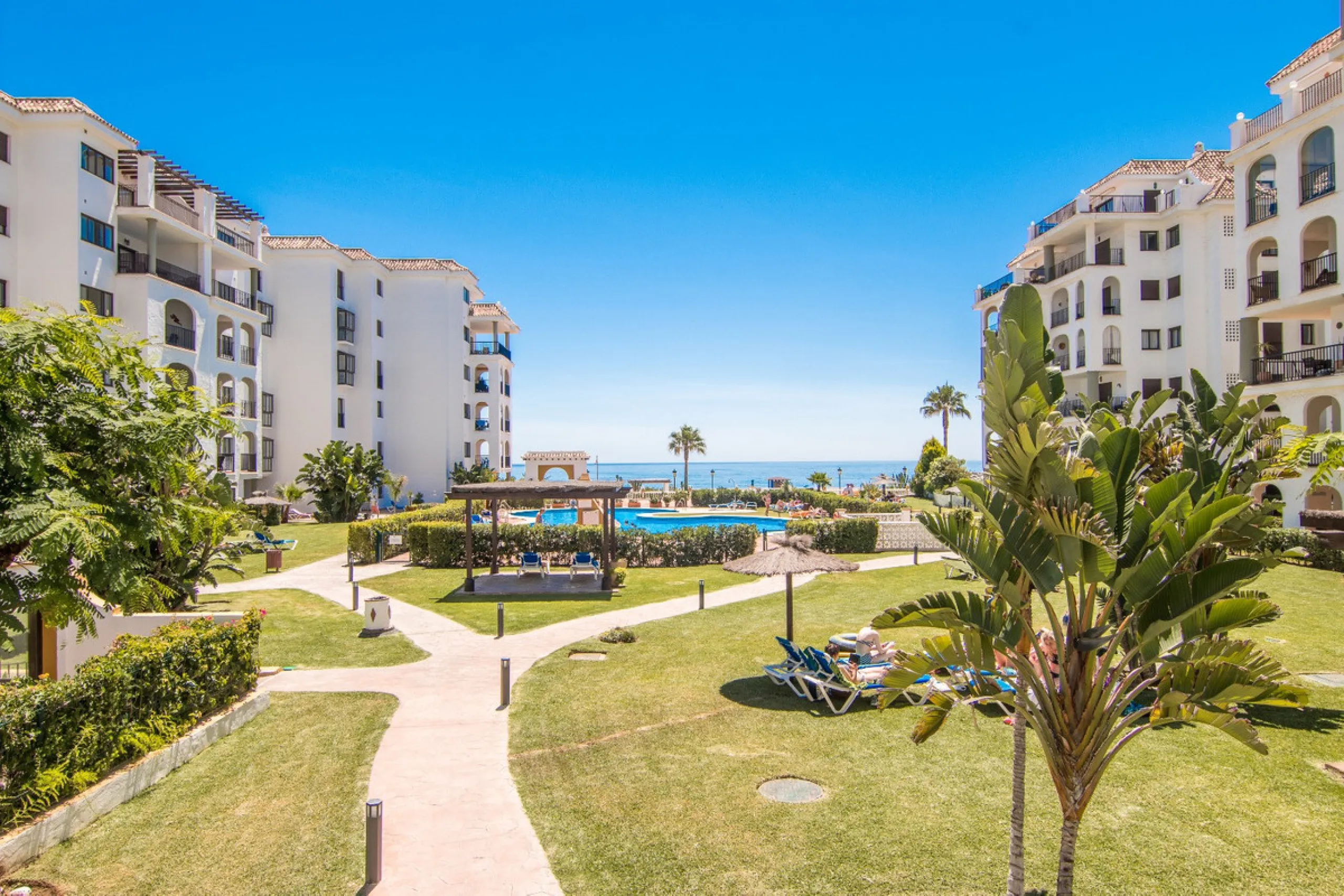 This exceptional two-bedroom, two-bathroom apartment is perfectly positioned on the front line of the beach in the sought-after area of Puerto La Duquesa, Manilva, Malaga. Offering a harmonious blend of comfort, style, and convenience, the property stands