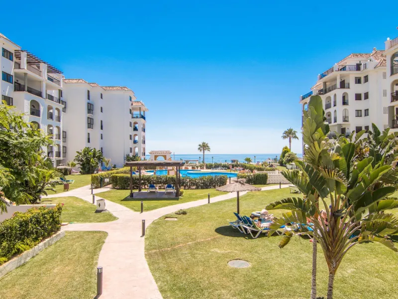This exceptional two-bedroom, two-bathroom apartment is perfectly positioned on the front line of the beach in the sought-after area of Puerto La Duquesa, Manilva, Malaga. Offering a harmonious blend of comfort, style, and convenience, the property stands