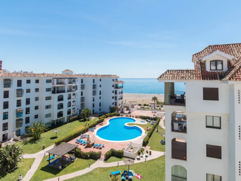 This exceptional two-bedroom, two-bathroom apartment is perfectly positioned on the front line of the beach in the sought-after area of Puerto La Duquesa, Manilva, Malaga. Offering a harmonious blend of comfort, style, and convenience, the property stands