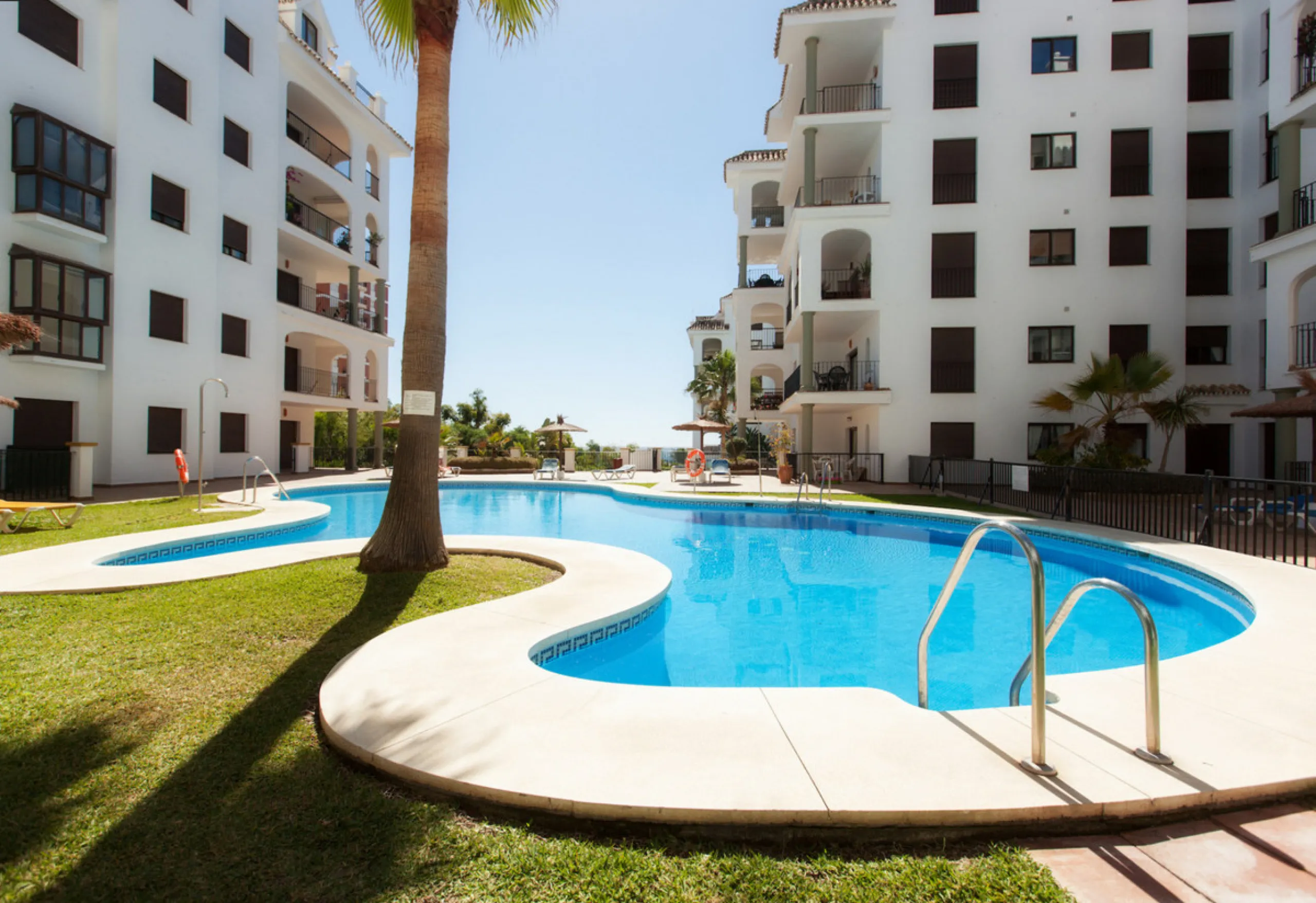 This exceptional two-bedroom, two-bathroom apartment is perfectly positioned on the front line of the beach in the sought-after area of Puerto La Duquesa, Manilva, Malaga. Offering a harmonious blend of comfort, style, and convenience, the property stands