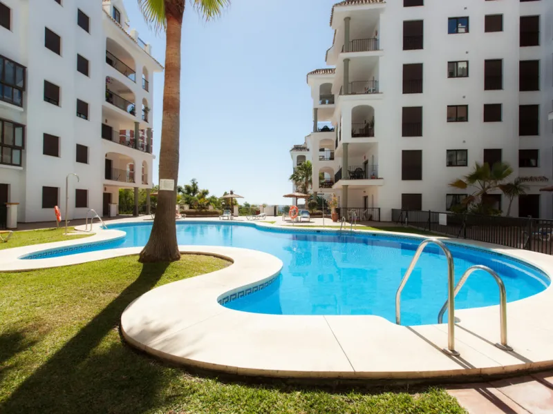 This exceptional two-bedroom, two-bathroom apartment is perfectly positioned on the front line of the beach in the sought-after area of Puerto La Duquesa, Manilva, Malaga. Offering a harmonious blend of comfort, style, and convenience, the property stands