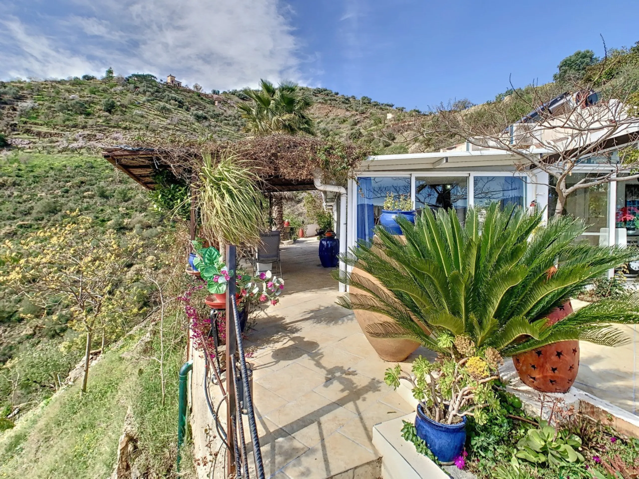 You are looking for a large villa with a heated swimming pool, neatly hidden nearly at the top of a mountain, surrounded by nature with breath-taking views of the valley up to the sea and the village of Arenas? This might just be what you are looking for.