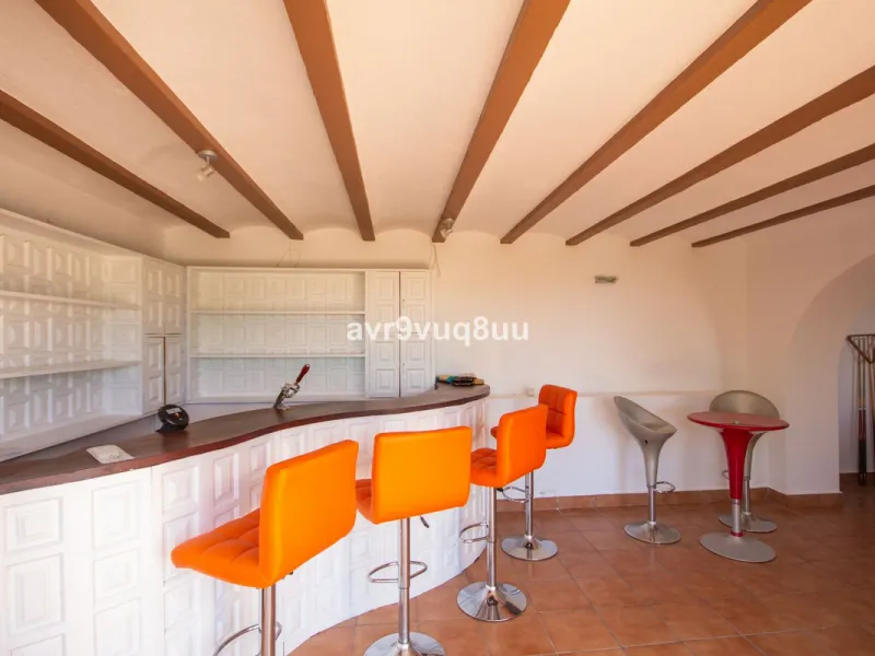 This property is stunning! Set in the heart of Mijas Costa, in the desirable Campo Mijas area. From the private entrance there is a driveway and garage, with steps down into the main entrance. This floor has a very spacious lounge area, with a great recep
