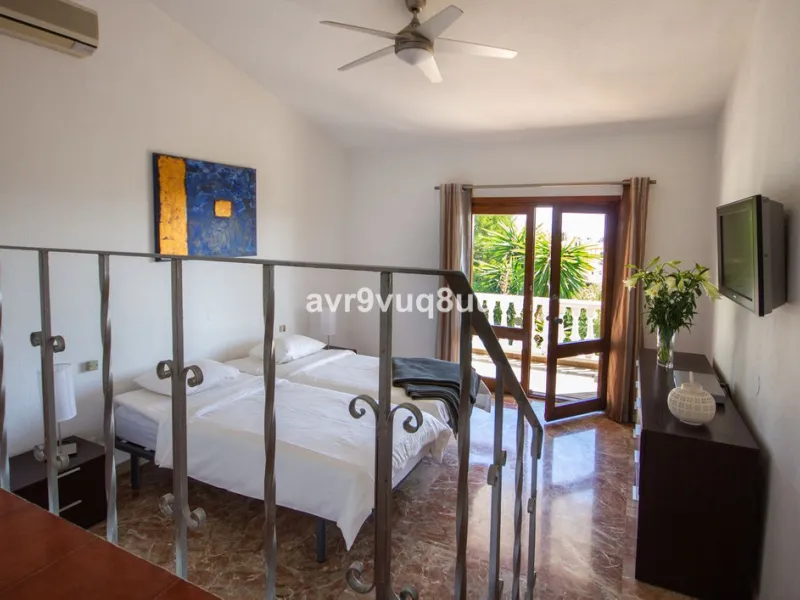 This property is stunning! Set in the heart of Mijas Costa, in the desirable Campo Mijas area. From the private entrance there is a driveway and garage, with steps down into the main entrance. This floor has a very spacious lounge area, with a great recep
