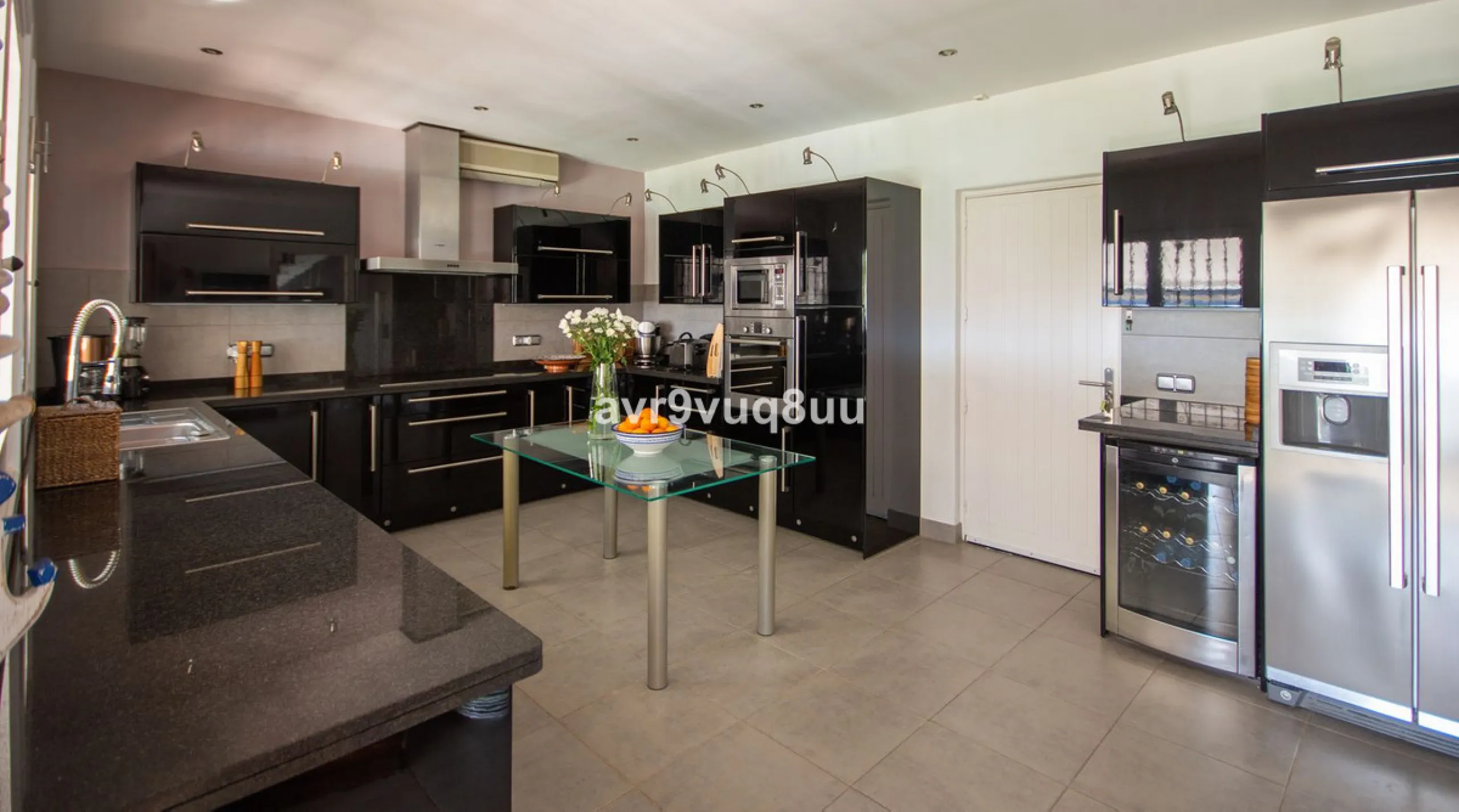 This property is stunning! Set in the heart of Mijas Costa, in the desirable Campo Mijas area. From the private entrance there is a driveway and garage, with steps down into the main entrance. This floor has a very spacious lounge area, with a great recep