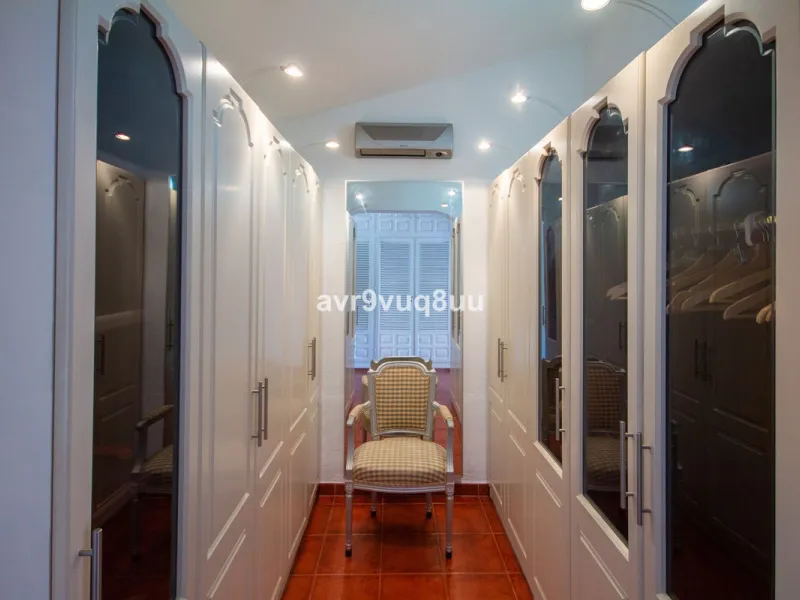 This property is stunning! Set in the heart of Mijas Costa, in the desirable Campo Mijas area. From the private entrance there is a driveway and garage, with steps down into the main entrance. This floor has a very spacious lounge area, with a great recep